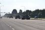 The tanks begin to roll into Sherwood Park amid a cloud of dust